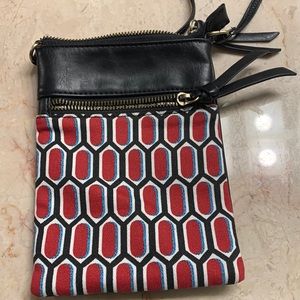 Crossbody bag, print fabric on one side, black leather on the other, 7.5”x 5.5”.